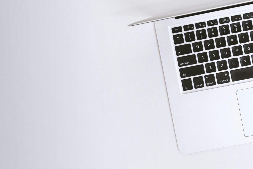Is It Time for a Device Upgrade? Check for These 7 Signs 1 Free Aerial view of a sleek laptop keyboard on a clean, white surface, ideal for tech backgrounds. Stock Photo