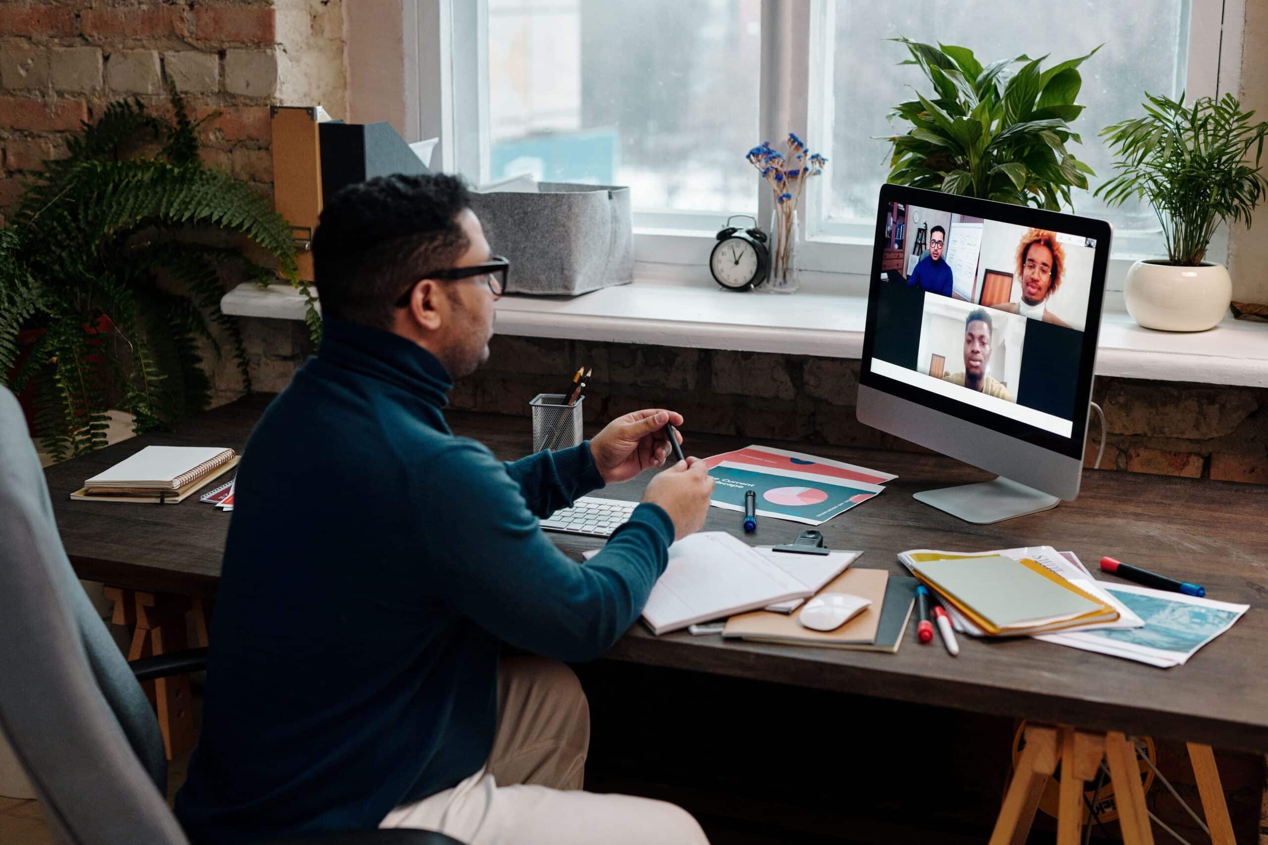 Blog 4 teacher-video-calling-with-his-students-using-a-computer